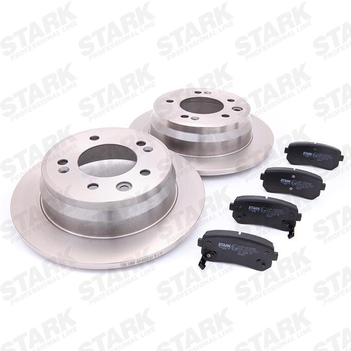 STARK SKBK-1090065 Brake discs and pads set Rear Axle, solid, with anti-squeak plate, with acoustic wear warning