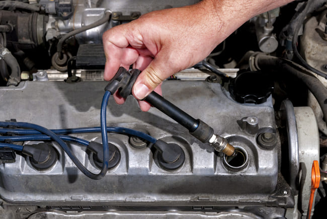 Where are spark plugs located?